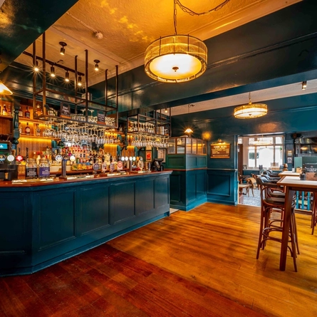 The bar and interior restaurant seating area of the Lucas Arms in London.