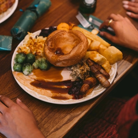 A plated meal on a festive decorated table.