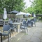 Exterior beer garden and playground of a pub with a seating area.