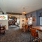 Interior dining area of a pub with a TV.