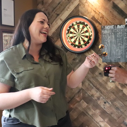 People playing darts