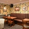 Interior corner seating area with brown sofas