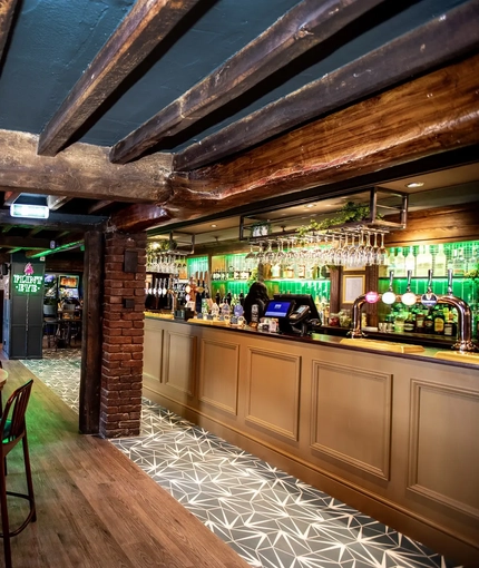 Interior bar area with feature fireplace