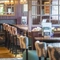 The interior restaurant and seating area with log burner at The Bell.