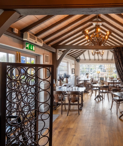 Interior restaurant with nice decor and curtain down the middle of the room