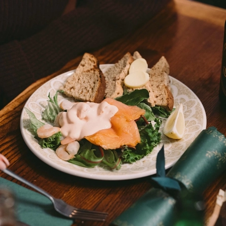A plated meal on a festive decorated table.
