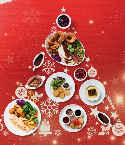 A banner promoting Christmas for Flaming Grill venues.