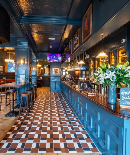 Some tables next to the bar in the Prince Of Wales.