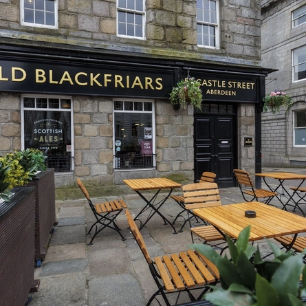 The exterior of the venue and beer garden seating area at The Old Blackfriars.