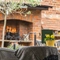 The exterior beer garden seating area with outdoor open fire and fireplace at The Crown.