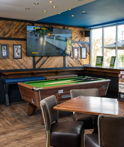 The interior pub games area with pool table, TV, restaurant and dining area at the Lutley Oak.