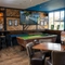 The interior pub games area with pool table, TV, restaurant and dining area at the Lutley Oak.