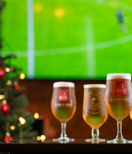 pints of beer in front of a TV