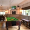 Pool table and TV in interior games area