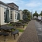 Exterior beer garden of a pub with a seating area.