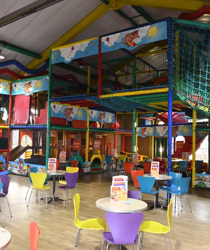 Interior kids dining and play area of a pub.