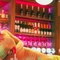 An image of one of the Drag Queens lay across the interior bar preparing a drink at The City Of Quebec.