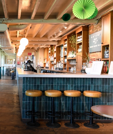 The bar and a seating area inside The Grain and Hop Store.