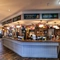 Interior dining area of a pub with a bar.