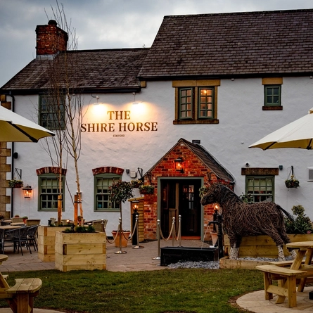 The beer garden and exterior of The Shire Horse.