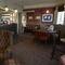 The seating area of the Anchor Inn with a fireplace.