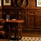 An image of the interior Snug seating area with wood panelling at The Ubiquitous Chip.