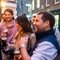 An image of a group of friends enjoying a selection of drinks stood outside The Kings Stores.