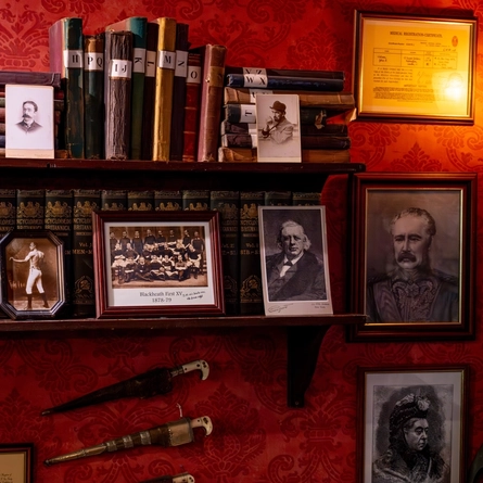 Decorative shelving and pictures at the Sherlock Holmes in Greater London.