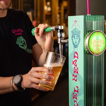 A person pouring a pint