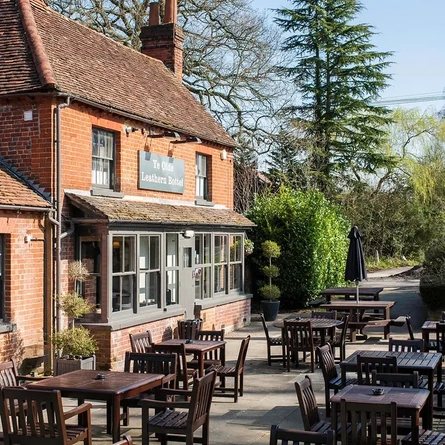 External view of a pub with outdoor seating area