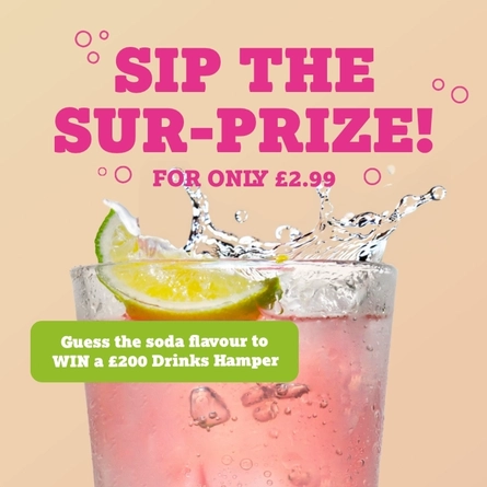 A banner showing a piece of lime falling into a pink coloured drink to advertise a Mystery Soda competition with a chance to win a drinks hamper at Farmhouse Kitchen venues.