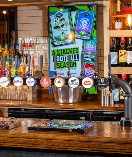 The interior bar area focusing on a pump with several pump clips advertising Strongbow, Strongbow Dark Fruits, San Miguel, Coors, Peroni, Madri, Birra Moretti, Carling, Stella Artois and Guinness all available at the Man of Gwent.  