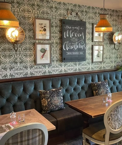 an interior restaurant and seating area