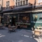 External view of a pub entrance and beer garden