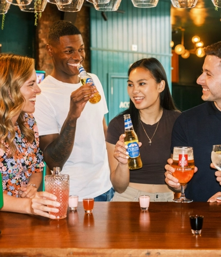 Friends enjoying a drink together in the pub