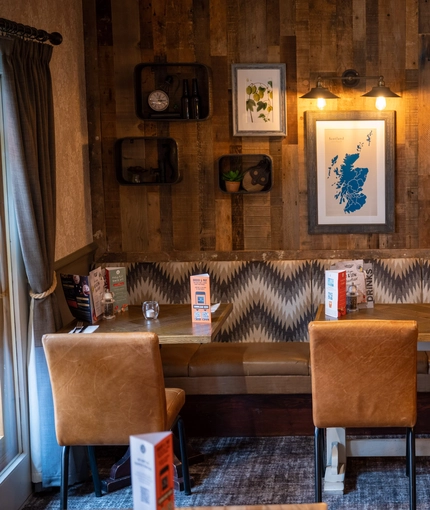 The interior restaurant seating area at The Caledonian Hotel.