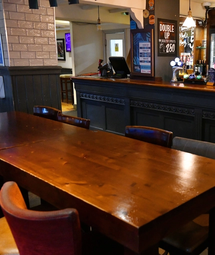 interior of the restaurant and seating area with bar