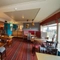 Interior dining area of a pub with a TV.