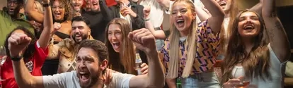 Fans celebrating in the pub