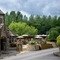 The exterior facade with signage and seating area at the Old Mill.