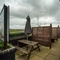 Exterior beer garden of a pub with a seating area.