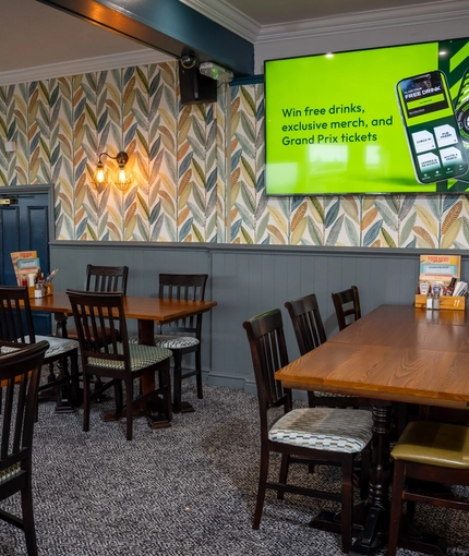 The interior restaurant and seating area with TV at the Dragon.