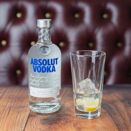 An advertising image of a bottle and glass of Absolut Vodka.