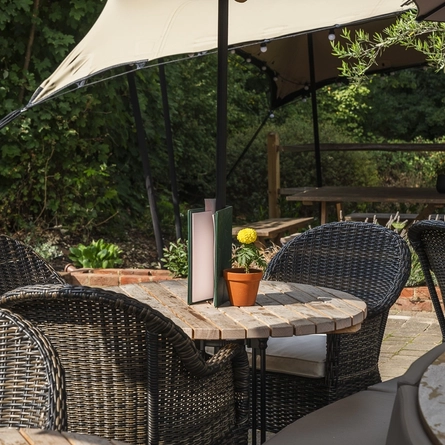 An image of one of the tables within the exterior beer garden seating area at The Crown.