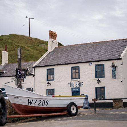 Exterior facade with a boat infront of the venue