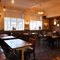 interior restaurant and seating area with tv
