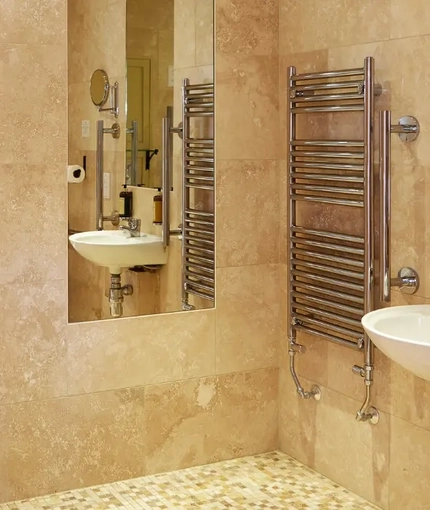The interior hotel bathroom with accessible shower and sink at the Fox.