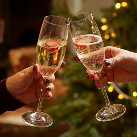 A 715x715 Boxing Day Drinks Advertising Image showing two glasses of sparkling white wine available at Chef & Brewer Venues.