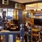 The interior restaurant seating area and decor at The Good Intent in Hornchurch.