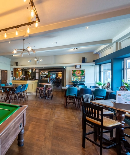 Interior seating area and pool table  of the Cricketers in Southwick